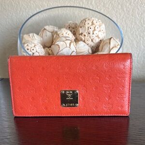 MCM Orange Embossed Logo Continental Wallet with Gold Plate